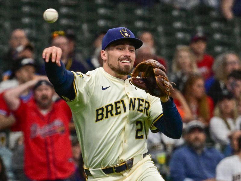 Jun 9, 2025; Milwaukee, Wisconsin, USA;  Milwaukee Brewers third baseman Caleb Durbin (21) throws out Atlanta Braves center fielder Michael Harris (not pictured) in the fourth inning at American Family Field. Mandatory Credit: Benny Sieu-Imagn Images