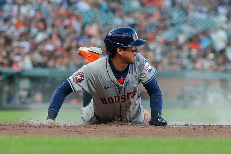 Jun 11, 2024; San Francisco, California, USA; Houston Astros outfielder Mauricio Dubón (14) scores a run during the second inning against the San Francisco Giants at Oracle Park. Mandatory Credit: Sergio Estrada-USA TODAY Sports