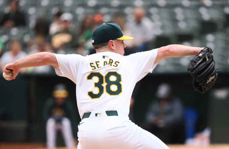 May 25, 2024; Oakland, California, USA; Oakland Athletics starting pitcher JP Sears (38) pitches the ball against the Houston Astros during the first inning at Oakland-Alameda County Coliseum. Mandatory Credit: Kelley L Cox-USA TODAY Sports