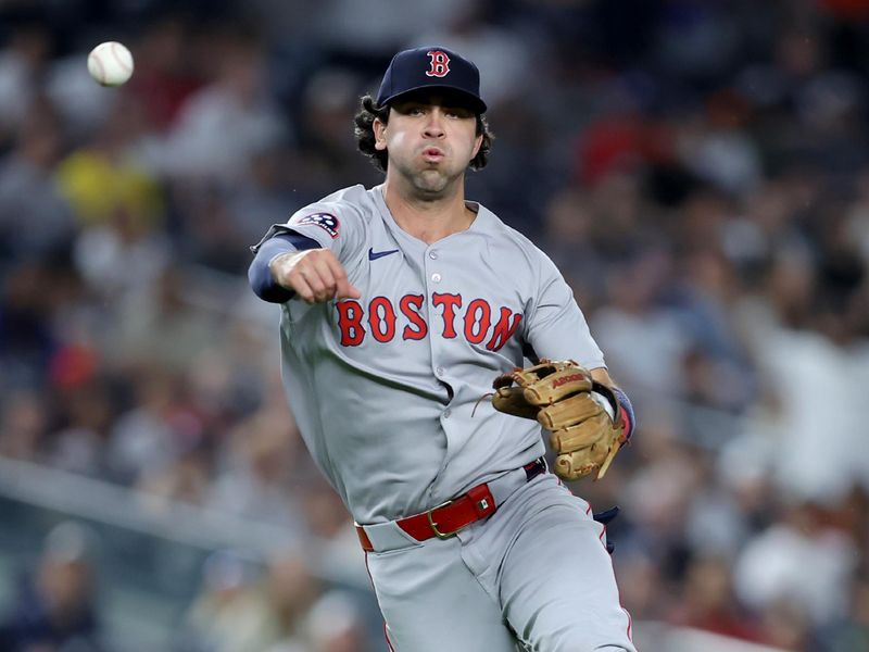 Jun 7, 2025; Bronx, New York, USA; Boston Red Sox third baseman Marcelo Mayer (39) throws out New York Yankees shortstop Oswald Peraza (not pictured) at first base on a ground ball during the ninth inning at Yankee Stadium. Mandatory Credit: Brad Penner-Imagn Images
