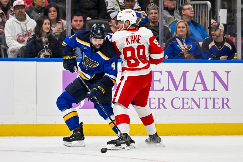 Dec 12, 2023; St. Louis, Missouri, USA;  St. Louis Blues defenseman Nick Leddy (4) and Detroit Red Wings right wing Patrick Kane (88) battle for the puck during the first period at Enterprise Center. Mandatory Credit: Jeff Curry-USA TODAY Sports