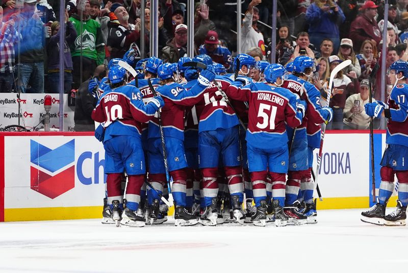 Oct 18, 2024; Denver, Colorado, USA; Members of the Colorado Avalanche celebrate defeating the Anaheim Ducks in overtime at Ball Arena. Mandatory Credit: Ron Chenoy-Imagn Images