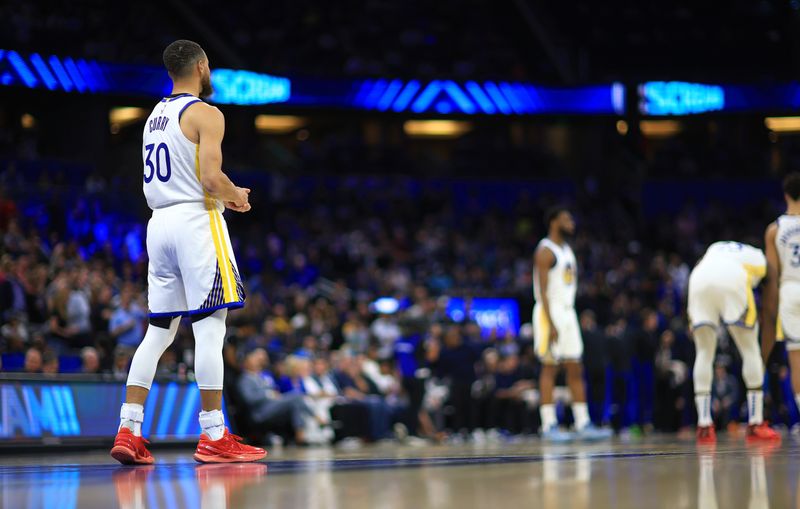 ORLANDO, FLORIDA - MARCH 27: Stephen Curry #30 of the Golden State Warriors looks on during a game against the Orlando Magic at Kia Center on March 27, 2024 in Orlando, Florida. NOTE TO USER: User expressly acknowledges and agrees that, by downloading and or using this photograph, User is consenting to the terms and conditions of the Getty Images License Agreement. (Photo by Mike Ehrmann/Getty Images)