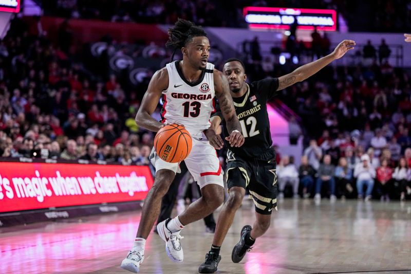 Jan 21, 2023; Athens, Georgia, USA; Georgia Bulldogs guard Mardrez McBride (13) handles the ball behind Vanderbilt Commodores guard Trey Thomas (12) during the second half at Stegeman Coliseum. Mandatory Credit: Dale Zanine-USA TODAY Sports