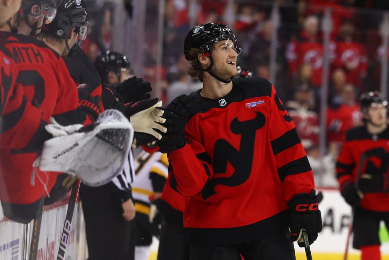 Mar 19, 2024; Newark, New Jersey, USA; New Jersey Devils center Dawson Mercer (91) celebrates his goal against the Pittsburgh Penguins during the first period at Prudential Center. Mandatory Credit: Ed Mulholland-USA TODAY Sports