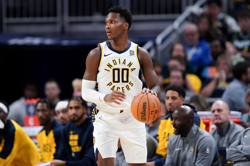 INDIANAPOLIS, INDIANA - OCTOBER 17: Bennedict Mathurin #00 of the Indiana Pacers dribbles the ball in the first quarter against the Charlotte Hornets during a preseason game at Gainbridge Fieldhouse on October 17, 2024 in Indianapolis, Indiana. NOTE TO USER: User expressly acknowledges and agrees that, by downloading and or using this photograph, User is consenting to the terms and conditions of the Getty Images License Agreement. (Photo by Dylan Buell/Getty Images)