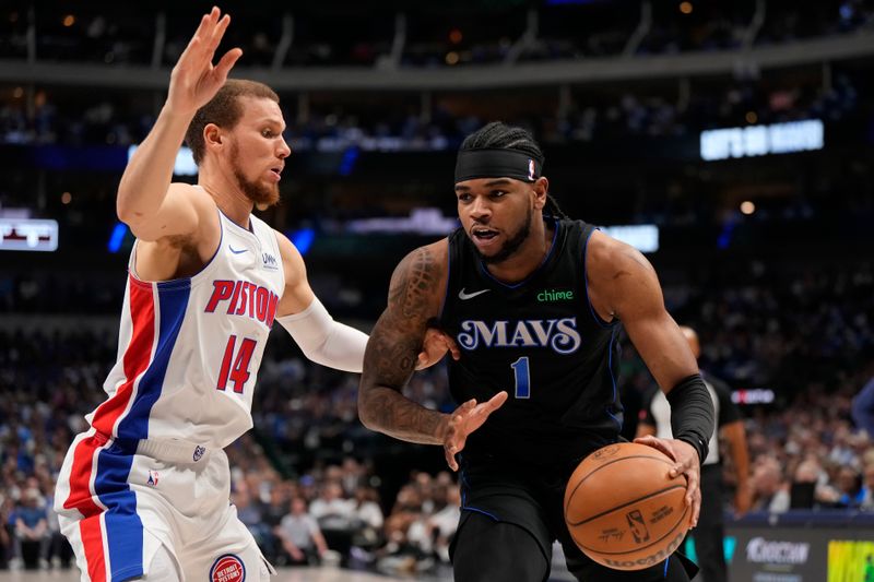 DALLAS, TEXAS - APRIL 12: Jaden Hardy #1 of the Dallas Mavericks is defended by Malachi Flynn #14 of the Detroit Pistons during the first half at American Airlines Center on April 12, 2024 in Dallas, Texas. NOTE TO USER: User expressly acknowledges and agrees that, by downloading and or using this photograph, User is consenting to the terms and conditions of the Getty Images License Agreement. (Photo by Sam Hodde/Getty Images)