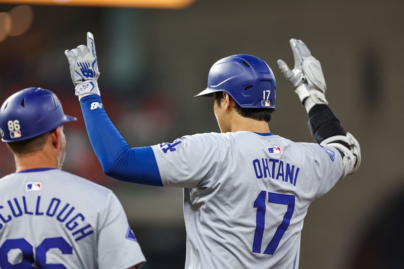 Jul 27, 2024; Houston, Texas, USA; Los Angeles Dodgers designated hitter Shohei Ohtani (17) celebrates after hitting an RBI single during the sixth inning against the Houston Astros at Minute Maid Park. Mandatory Credit: Troy Taormina-USA TODAY Sports