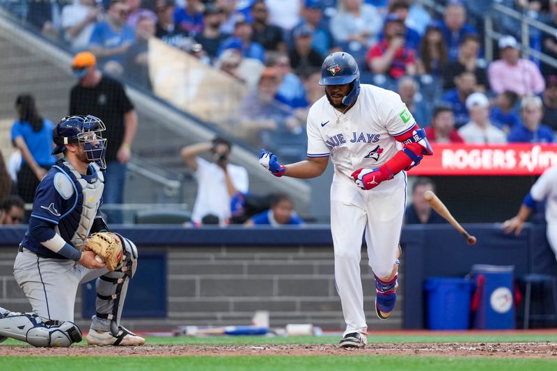 May 15, 2025; Toronto, Ontario, CAN; Toronto Blue Jays first base Vladimir Guerrero Jr. (27) celebrates taking a walk against the Tampa Bay Rays during the eighth inning at Rogers Centre. Mandatory Credit: Kevin Sousa-Imagn Images
