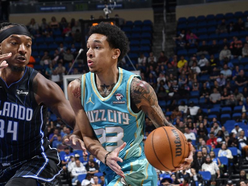 ORLANDO, FL - MARCH 19: Tre Mann #23 of the Charlotte Hornets drives to the basket during the game against the Orlando Magic on March 19, 2024 at the Kia Center in Orlando, Florida. NOTE TO USER: User expressly acknowledges and agrees that, by downloading and or using this photograph, User is consenting to the terms and conditions of the Getty Images License Agreement. Mandatory Copyright Notice: Copyright 2024 NBAE (Photo by Fernando Medina/NBAE via Getty Images)