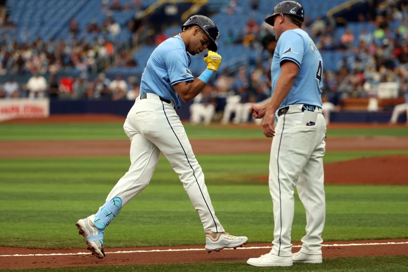 Jul 31, 2024; St. Petersburg, Florida, USA;  Tampa Bay Rays infielder Christopher Morel (24) celebrates with third base coach Brady Williams (4) after hitting a home run against the Miami Marlins during the first inning at Tropicana Field. Mandatory Credit: Kim Klement Neitzel-USA TODAY Sports