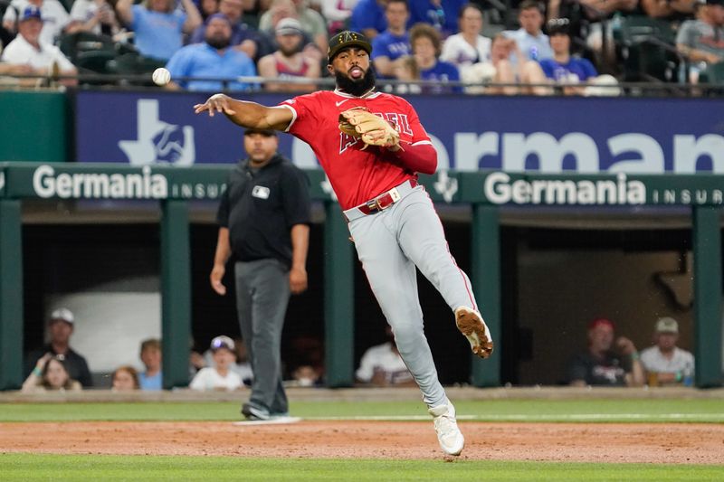 May 18, 2024; Arlington, Texas, USA; Los Angeles Angels third baseman Luis Rengifo (2) throws to first base during the second inning against the Texas Rangers at Globe Life Field. Mandatory Credit: Raymond Carlin III-USA TODAY Sports