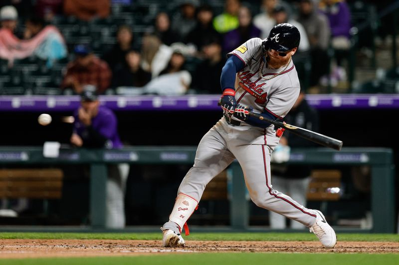 Apr 28, 2025; Denver, Colorado, USA; Atlanta Braves left fielder Alex Verdugo (8) hits a single in the eighth inning against the Colorado Rockies at Coors Field. Mandatory Credit: Isaiah J. Downing-Imagn Images