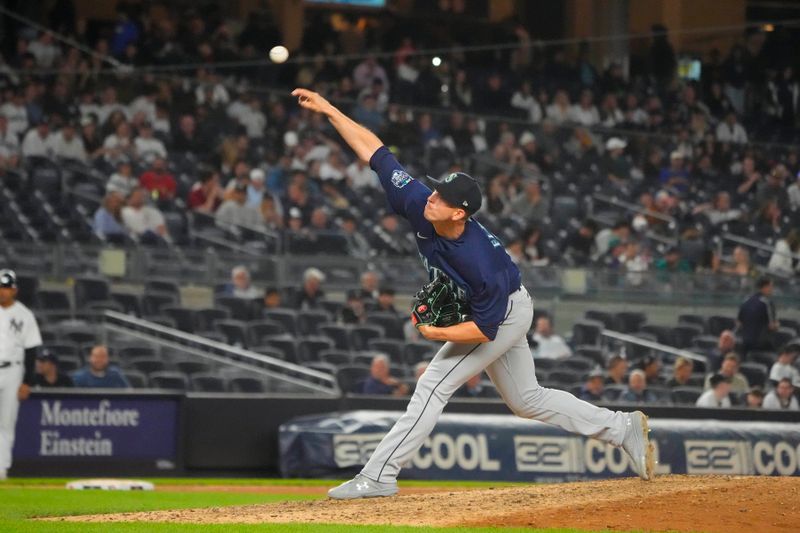 Jun 22, 2023; Bronx, New York, USA; Seattle Mariners pitcher Chris Flexen (77) delivers a pitch against the New York Yankees during the eighth inning at Yankee Stadium. Mandatory Credit: Gregory Fisher-USA TODAY Sports