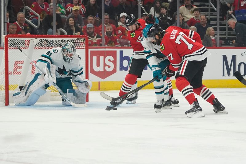 Oct 17, 2024; Chicago, Illinois, USA; Chicago Blackhawks left wing Patrick Maroon (77) skates in on San Jose Sharks goaltender Vitek Vanecek (41)  during the first period at United Center. Mandatory Credit: David Banks-Imagn Images