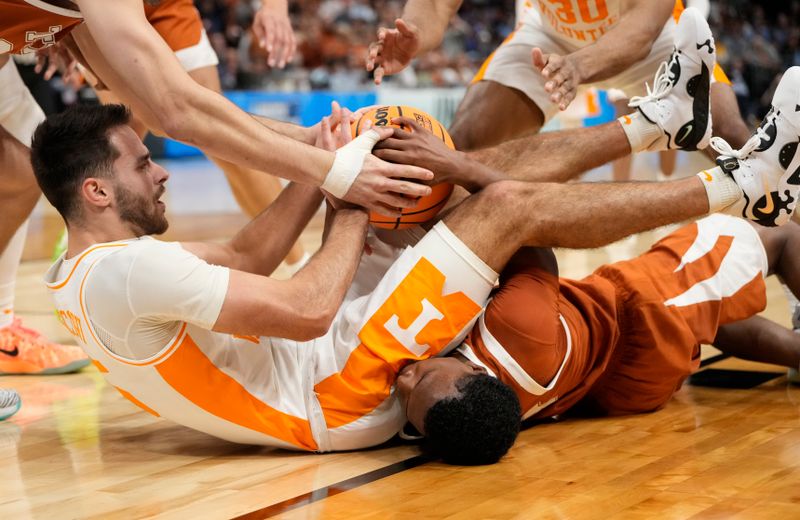 March 23, 2024, Charlotte, NC, USA; Tennessee Volunteers guard Santiago Vescovi (25) battles for the ball on the floor with Texas Longhorns guard Max Abmas (bottom) in the second round of the 2024 NCAA Tournament at the Spectrum Center. Mandatory Credit: Bob Donnan-USA TODAY Sports