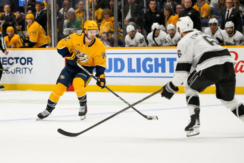 Nov 4, 2024; Nashville, Tennessee, USA;  Nashville Predators center Tommy Novak (82) takes a shot on goal against the Los Angeles Kings during the first period at Bridgestone Arena. Mandatory Credit: Steve Roberts-Imagn Images