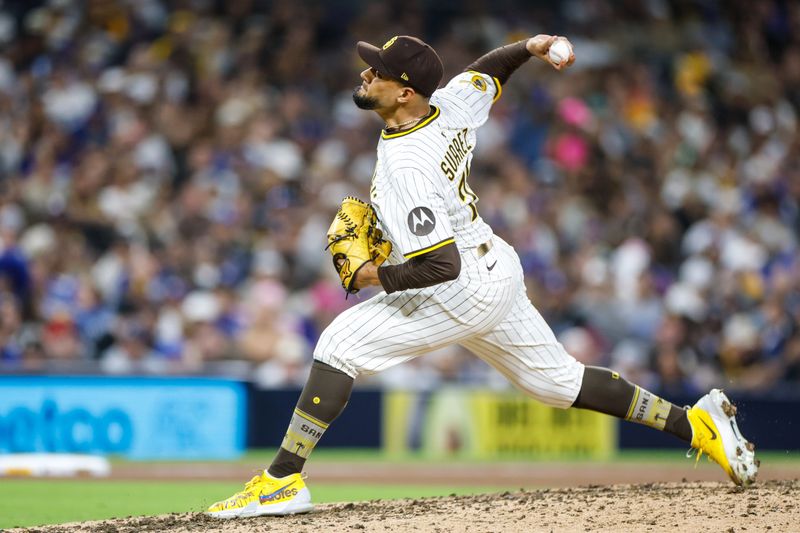 Jun 9, 2025; San Diego, California, USA; San Diego Padres relief pitcher Robert Suarez (75) throws a pitch during the ninth inning against the Los Angeles Dodgers at Petco Park. Mandatory Credit: David Frerker-Imagn Images