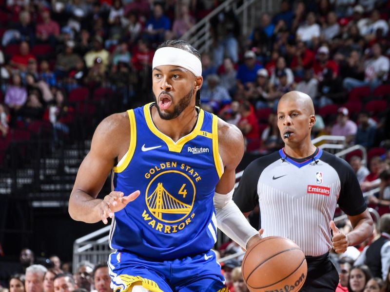 HOUSTON, TX - NOVEMBER 2:  Moses Moody #4 of the Golden State Warriors dribbles the ball during the game on October 22, 2024 at the Toyota Center in Houston, Texas. NOTE TO USER: User expressly acknowledges and agrees that, by downloading and or using this photograph, User is consenting to the terms and conditions of the Getty Images License Agreement. Mandatory Copyright Notice: Copyright 2024 NBAE (Photo by Logan Riely/NBAE via Getty Images)