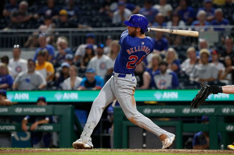 Aug 26, 2024; Pittsburgh, Pennsylvania, USA;  Chicago Cubs right  fielder Cody Bellinger (24) hits an RBI double against the Pittsburgh Pirates during the ninth inning at PNC Park. Mandatory Credit: Charles LeClaire-USA TODAY Sports