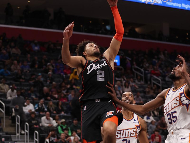 DETROIT, MICHIGAN - NOVEMBER 05: Cade Cunningham #2 of the Detroit Pistons drives to the basket against Kevin Durant #35 of the Phoenix Suns during the second half at Little Caesars Arena on November 05, 2023 in Detroit, Michigan. NOTE TO USER: User expressly acknowledges and agrees that, by downloading and or using this photograph, User is consenting to the terms and conditions of the Getty Images License Agreement. (Photo by Gregory Shamus/Getty Images)