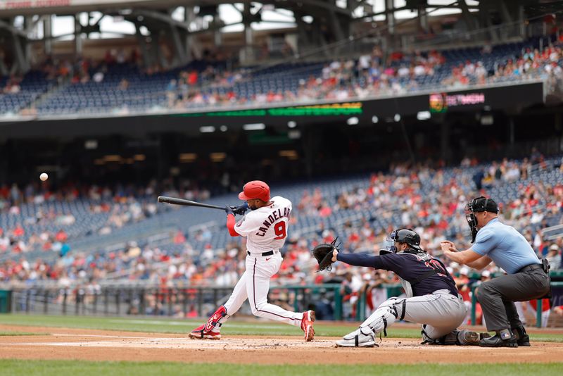 Apr 16, 2023; Washington, District of Columbia, USA; Washington Nationals third baseman Jeimer Candelario (9) hits an RBI single against the Cleveland Guardians during the first inning at Nationals Park. Mandatory Credit: Geoff Burke-USA TODAY Sports