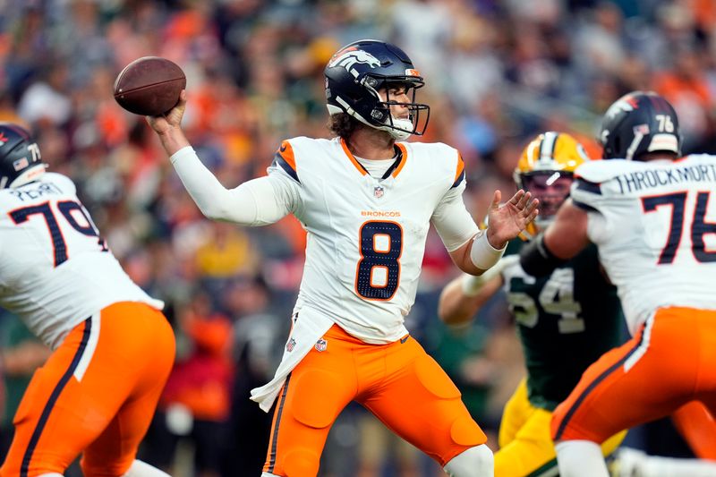 Denver Broncos quarterback Jarrett Stidham (8) passes during the first half of a preseason NFL football game against the Green Bay Packers, Sunday, Aug. 18, 2024, in Denver. (AP Photo/Jack Dempsey)