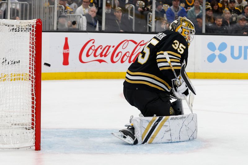 Feb 17, 2024; Boston, Massachusetts, USA; A shot by Los Angeles Kings defenseman Vladislav Gavrikov (84) gets past Boston Bruins goaltender Linus Ullmark (35) for a goal during the second period at TD Garden. Mandatory Credit: Winslow Townson-USA TODAY Sports