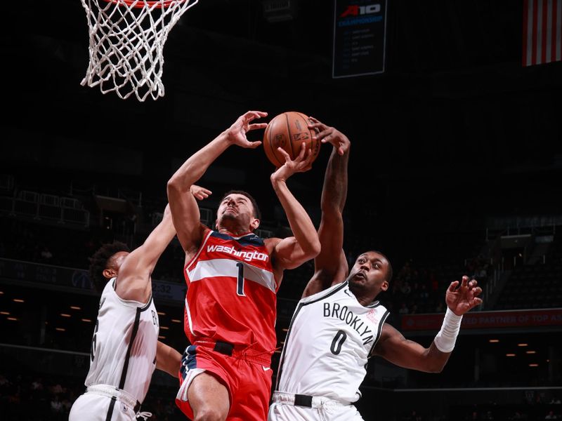 BROOKLYN, NY - OCTOBER 14: Dariq Whitehead #0 of the Brooklyn Nets blocks the shot during the game against the Washington Wizards during a NBA preseason game on October 14, 2024 at Barclays Center in Brooklyn, New York. NOTE TO USER: User expressly acknowledges and agrees that, by downloading and or using this Photograph, user is consenting to the terms and conditions of the Getty Images License Agreement. Mandatory Copyright Notice: Copyright 2024 NBAE (Photo by Nathaniel S. Butler/NBAE via Getty Images)