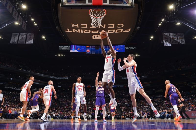 PHOENIX, AZ - FEBRUARY 14:  Shake Milton #5 of the Detroit Pistons grabs a rebound during the game against the Phoenix Suns on February 14, 2024 at Footprint Center in Phoenix, Arizona. NOTE TO USER: User expressly acknowledges and agrees that, by downloading and or using this photograph, user is consenting to the terms and conditions of the Getty Images License Agreement. Mandatory Copyright Notice: Copyright 2024 NBAE (Photo by Barry Gossage/NBAE via Getty Images)