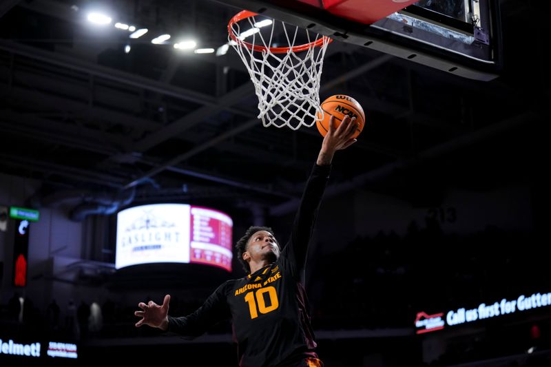 Jan 18, 2025; Cincinnati, Ohio, USA;  Arizona State Sun Devils guard BJ Freeman (10) drives to the basket against the Cincinnati Bearcats in the second half at Fifth Third Arena. Mandatory Credit: Aaron Doster-Imagn Images