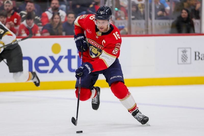 Dec 23, 2023; Sunrise, Florida, USA; Florida Panthers center Aleksander Barkov (16) moves the puck against the Vegas Golden Knights during the second period at Amerant Bank Arena. Mandatory Credit: Sam Navarro-USA TODAY Sports