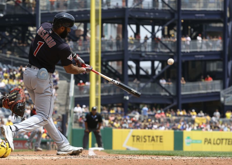 Jul 19, 2023; Pittsburgh, Pennsylvania, USA;  Cleveland Guardians shortstop Amed Rosario (1) hits a two run double against the Pittsburgh Pirates during the fifth inning at PNC Park. Mandatory Credit: Charles LeClaire-USA TODAY Sports