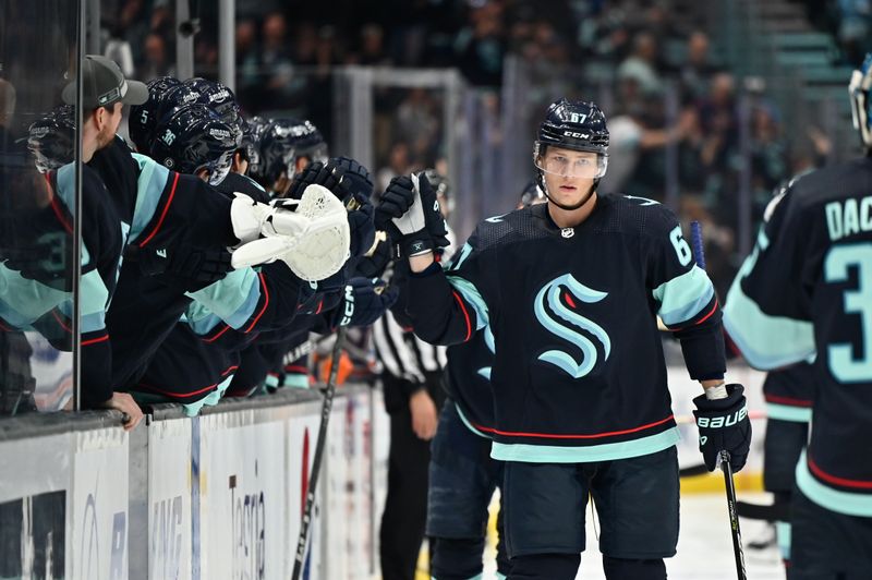 Sep 26, 2022; Seattle, Washington, USA; Seattle Kraken center Morgan Geekie (67) celebrates with the bench after scoring a goal against the Edmonton Oilers during the third period at Climate Pledge Arena. Mandatory Credit: Steven Bisig-USA TODAY Sports