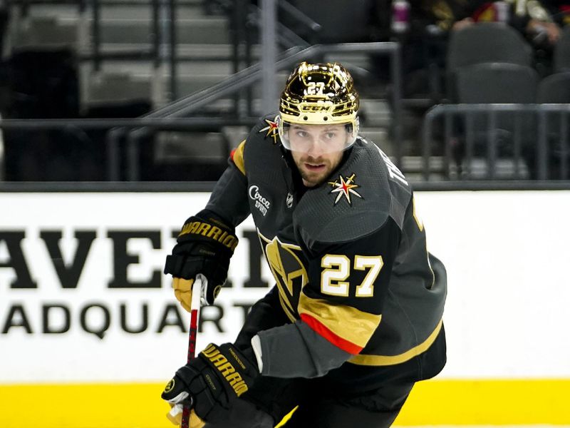 Mar 19, 2023; Las Vegas, Nevada, USA; Vegas Golden Knights defenseman Shea Theodore (27) skates with the puck during the first period against the Columbus Blue Jackets at T-Mobile Arena. Mandatory Credit: Lucas Peltier-USA TODAY Sports