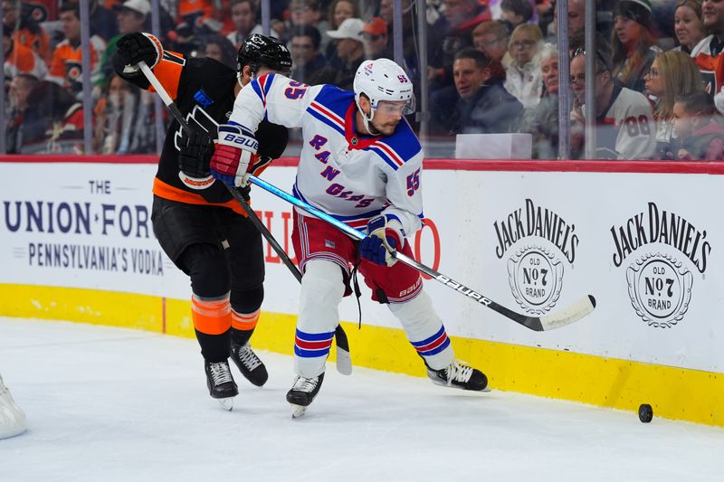 Nov 29, 2024; Philadelphia, Pennsylvania, USA; New York Rangers defenseman Ryan Lindgren (55) chases the puck against Philadelphia Flyers center Sean Couturier (14) in the first period at Wells Fargo Center. Mandatory Credit: Kyle Ross-Imagn Images