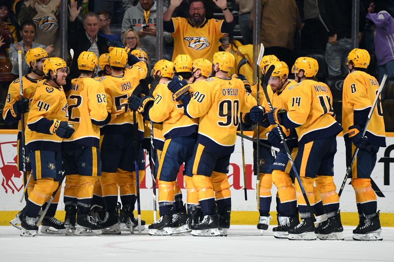 Feb 10, 2024; Nashville, Tennessee, USA; Nashville Predators players celebrate after a win against the Arizona Coyotes at Bridgestone Arena. Mandatory Credit: Christopher Hanewinckel-USA TODAY Sports