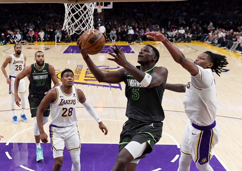 LOS ANGELES, CALIFORNIA - APRIL 7: Anthony Edwards #5 of the Minnesota Timberwolves scores a basket against Cam Reddish #5 of the Los Angeles Lakers during the first half at Crypto.com Arena on April 7, 2024 in Los Angeles, California. NOTE TO USER: User expressly acknowledges and agrees that, by downloading and or using this photograph, User is consenting to the terms and conditions of the Getty Images License Agreement. (Photo by Kevork Djansezian/Getty Images)