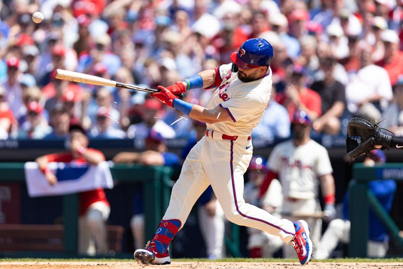 May 8, 2024; Philadelphia, Pennsylvania, USA; Philadelphia Phillies designated hitter Kyle Schwarber (12) breaks his bat while hitting an RBI sacrifice fly against the Toronto Blue Jays during the third inning at Citizens Bank Park. Mandatory Credit: Bill Streicher-USA TODAY Sports