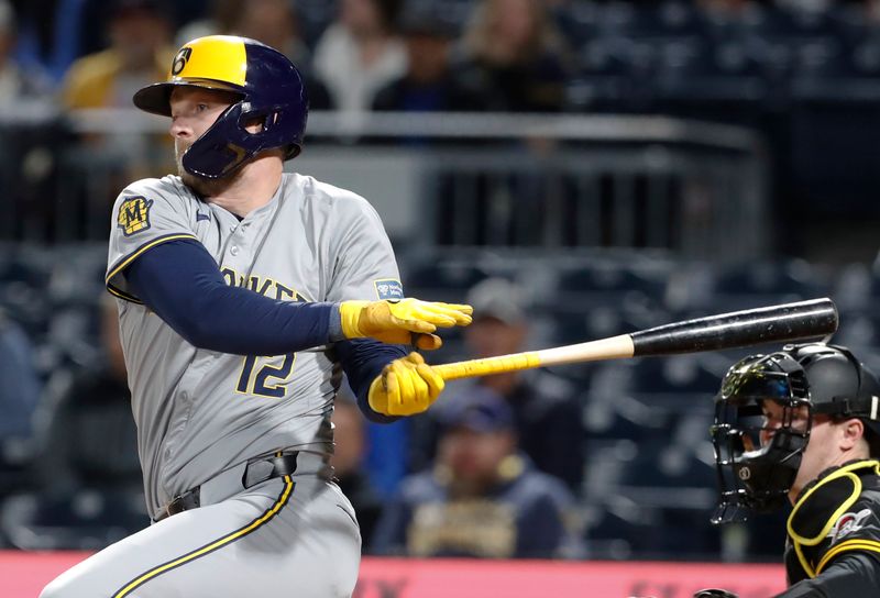 Apr 22, 2024; Pittsburgh, Pennsylvania, USA;  Milwaukee Brewers designated hitter Rhys Hoskins (12) drives in a run on a fielders choice against the Pittsburgh Pirates during the eighth inning at PNC Park. Pittsburgh won 4-2. Mandatory Credit: Charles LeClaire-USA TODAY Sports