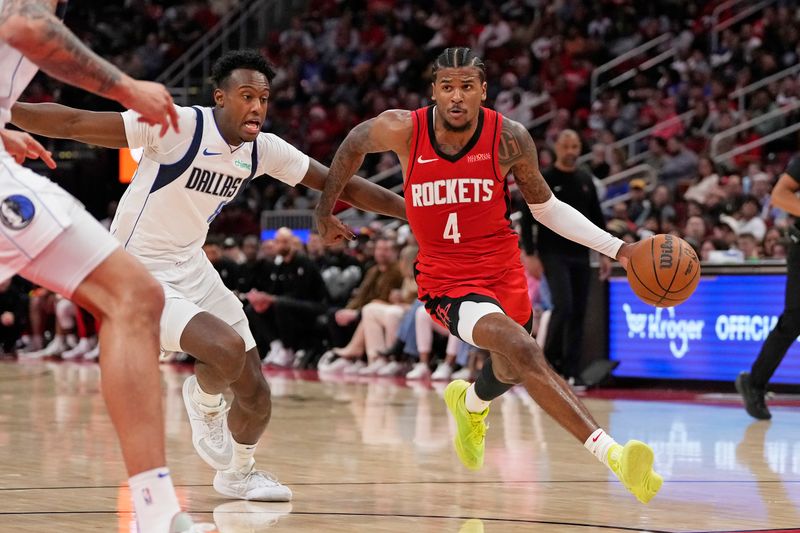 HOUSTON, TX - JANUARY 1:  Jalen Green #4 of the Houston Rockets drives to the basket during the game against the Dallas Mavericks on January 1, 2025 at the Toyota Center in Houston, Texas. NOTE TO USER: User expressly acknowledges and agrees that, by downloading and or using this photograph, User is consenting to the terms and conditions of the Getty Images License Agreement. Mandatory Copyright Notice: Copyright 2025 NBAE (Photo by Kevin M. Cox/NBAE via Getty Images)