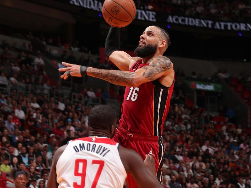 MIAMI, FL - MARCH 10: Caleb Martin #16 of the Miami Heat dunks the ball during the game against the Washington Wizards on March 10, 2024 at Kaseya Center in Miami, Florida. NOTE TO USER: User expressly acknowledges and agrees that, by downloading and or using this Photograph, user is consenting to the terms and conditions of the Getty Images License Agreement. Mandatory Copyright Notice: Copyright 2024 NBAE (Photo by Issac Baldizon/NBAE via Getty Images)