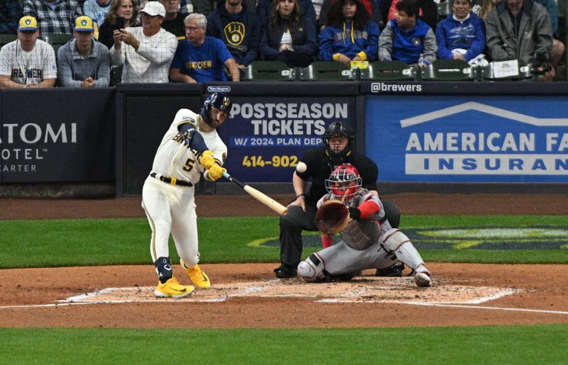 Sep 28, 2023; Milwaukee, Wisconsin, USA; Milwaukee Brewers outfielder Garrett Mitchell (5) hits a double against the St. Louis Cardinals in the fourth inning at American Family Field. Mandatory Credit: Michael McLoone-USA TODAY Sports