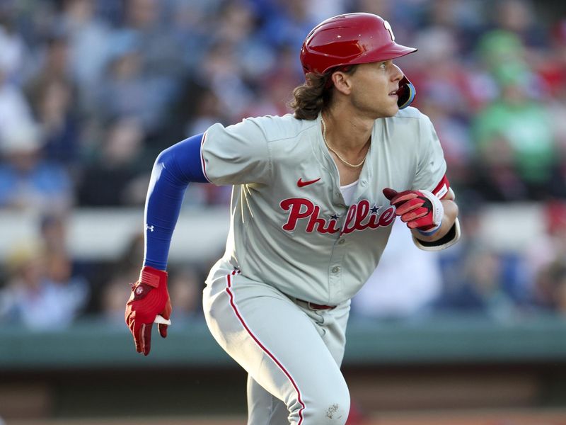 Mar 19, 2024; Lakeland, Florida, USA;  Philadelphia Phillies first baseman Alec Bohm (28) runs to first after hitting a base hit against the Detroit Tigers in the fourth inning at Publix Field at Joker Marchant Stadium. Mandatory Credit: Nathan Ray Seebeck-USA TODAY Sports