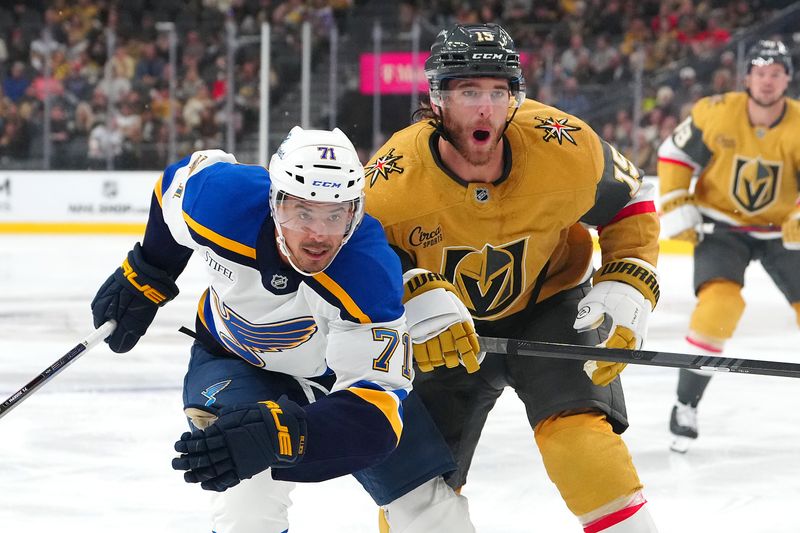 Oct 11, 2024; Las Vegas, Nevada, USA; St. Louis Blues right wing Mathieu Joseph (71) skates ahead of Vegas Golden Knights defenseman Noah Hanifin (15) during the first period at T-Mobile Arena. Mandatory Credit: Stephen R. Sylvanie-Imagn Images