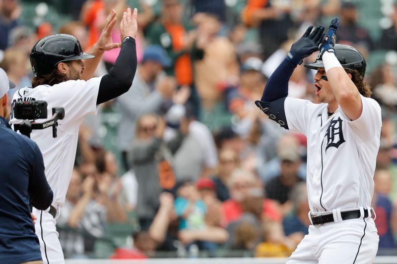 Jun 11, 2023; Detroit, Michigan, USA;  Detroit Tigers second baseman Zach McKinstry (39) receives congratulations from right fielder Jake Marisnick (15) after he hits a two run home run in the fourth inning against the Arizona Diamondbacks at Comerica Park. Mandatory Credit: Rick Osentoski-USA TODAY Sports