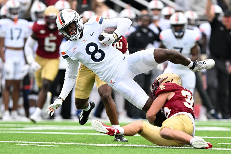 Sep 30, 2023; Chestnut Hill, Massachusetts, USA; Virginia Cavaliers wide receiver Malachi Fields (8) is tackled by Boston College Eagles defensive back John Pupel (35) during the first half at Alumni Stadium. Mandatory Credit: Brian Fluharty-USA TODAY Sports