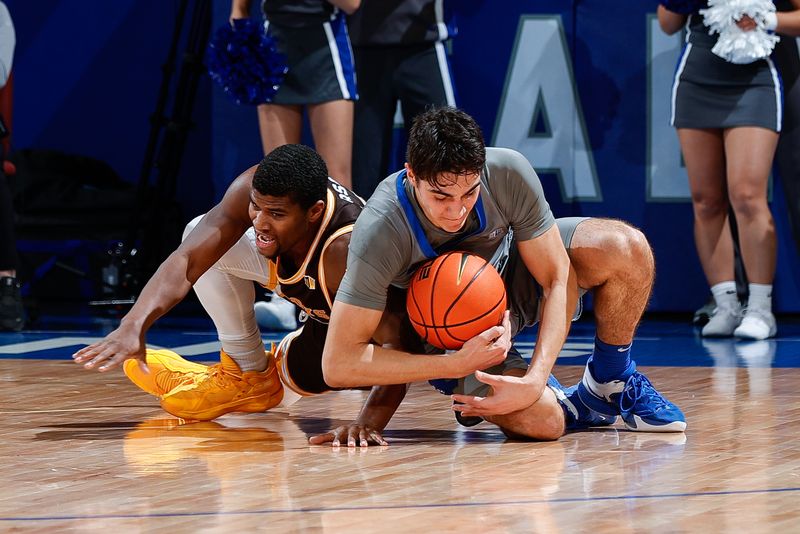 Jan 17, 2023; Colorado Springs, Colorado, USA; Wyoming Cowboys guard Ethan Anderson (20) and Air Force Falcons forward Beau Becker (14) battle for a loose ball in the second half at Clune Arena. Mandatory Credit: Isaiah J. Downing-USA TODAY Sports