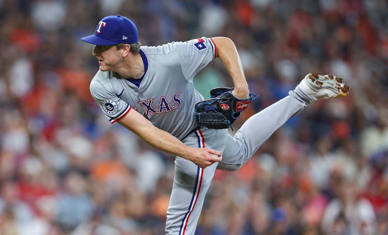 Jul 14, 2024; Houston, Texas, USA; Texas Rangers relief pitcher Josh Sborz (66) delivers a pitch during the fifth inning against the Houston Astros at Minute Maid Park. Mandatory Credit: Troy Taormina-USA TODAY Sports