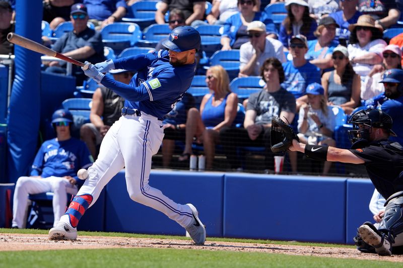 Mar 23, 2024; Dunedin, Florida, USA; Toronto Blue Jays center fielder Kevin Kiermaier hits a foul ball into his knee against the Detroit Tigers during the first inning at TD Ballpark. Kiermaier was injured on the play and left the game. Mandatory Credit: Dave Nelson-USA TODAY Sports